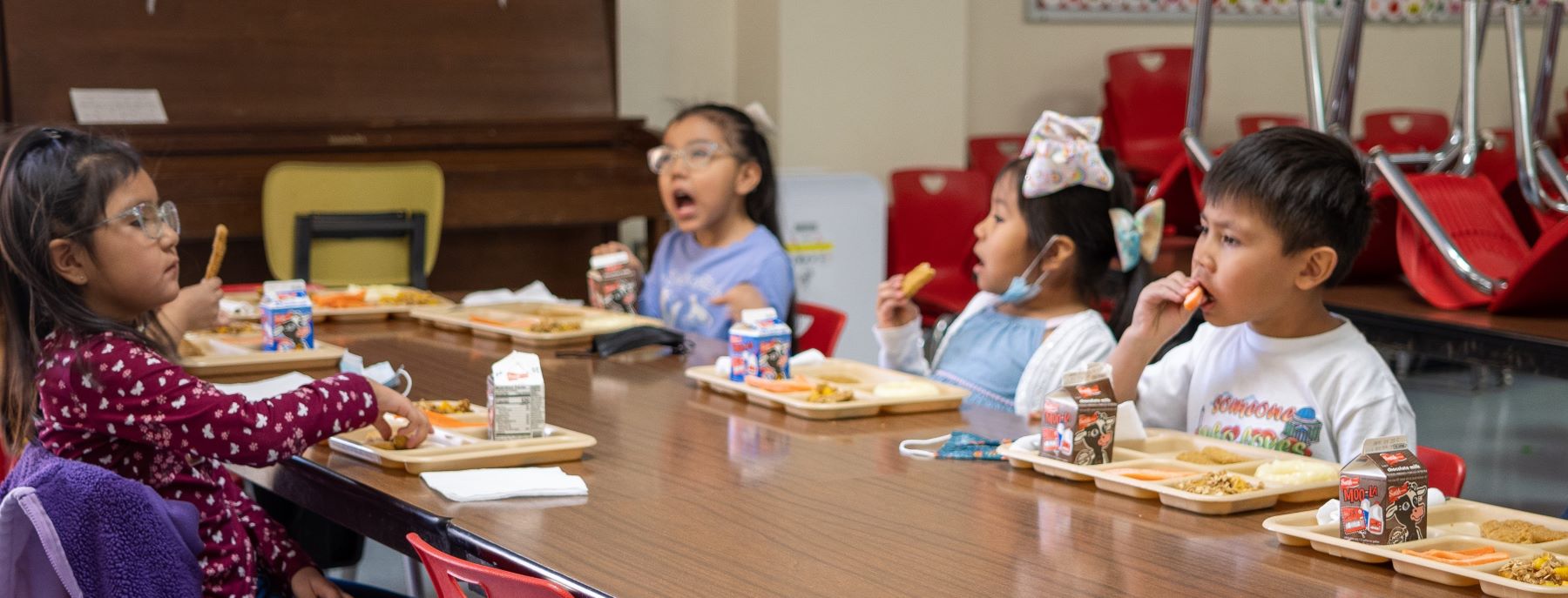 students eating lunch together in cafeteria